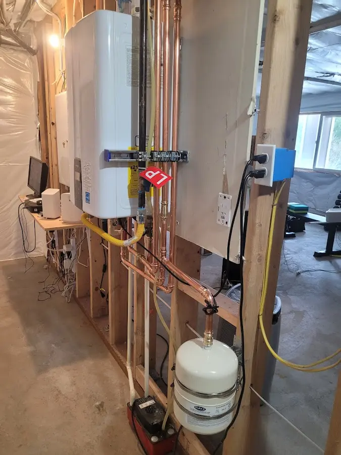 Licensed plumber repairing a kitchen sink in Celina